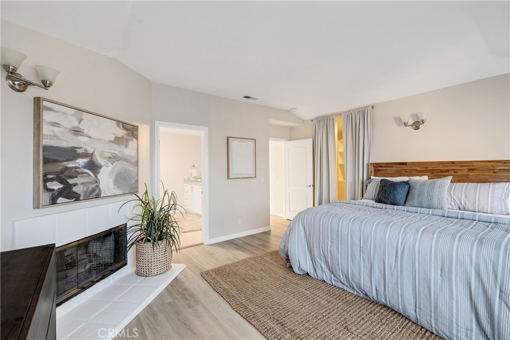 750 14th Street Manhattan Beach, CA 90266 - Photo 44 of 60 a bedroom with a large bed and a painting on the wall
