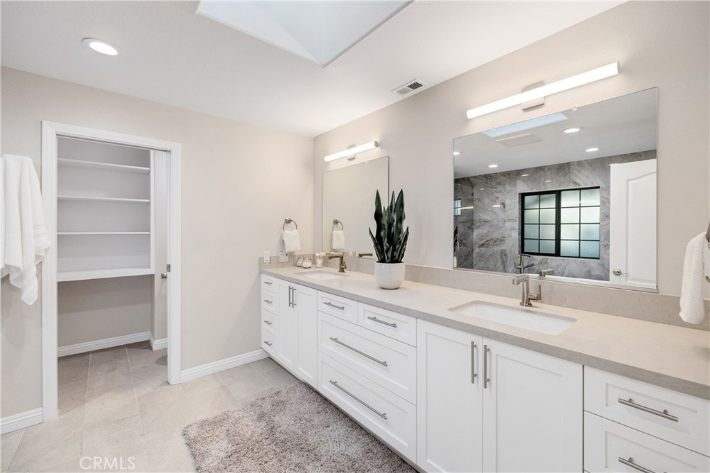 750 14th Street Manhattan Beach, CA 90266 - Photo 45 of 60 a bathroom with double sink and a mirror