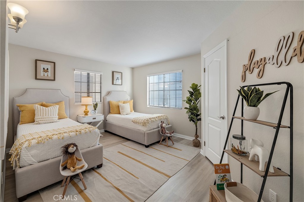 750 14th Street Manhattan Beach, CA 90266 - Photo 51 of 60 a bedroom with a bed and wooden floor