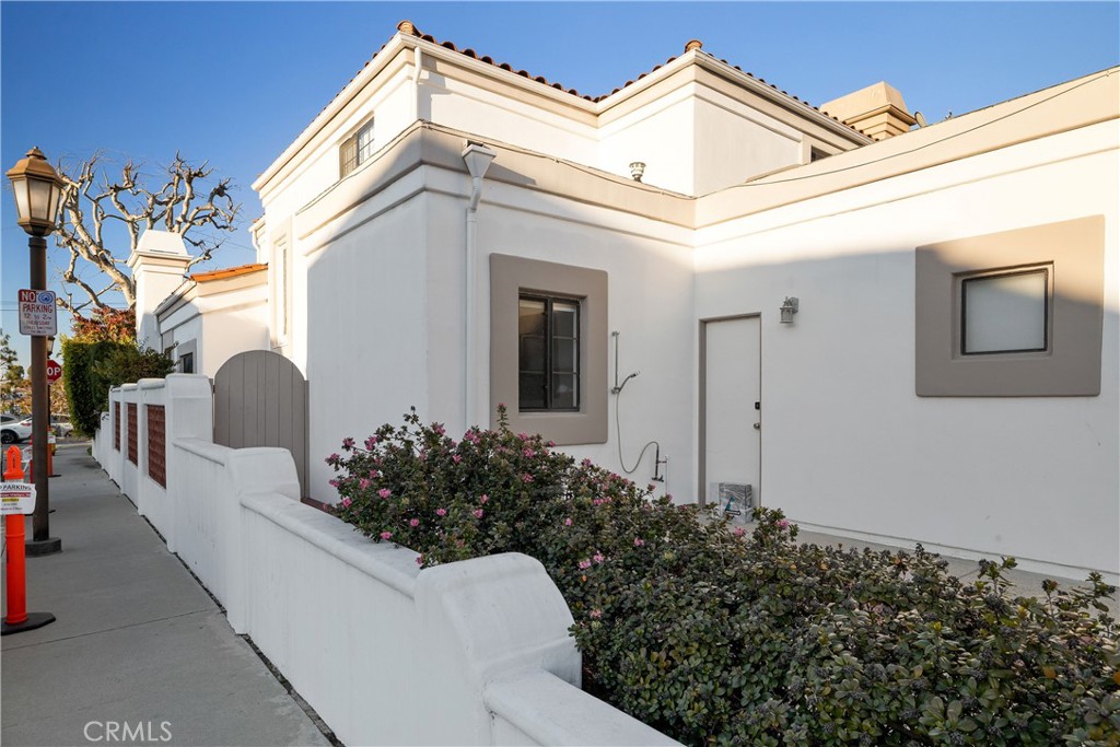 750 14th Street Manhattan Beach, CA 90266 - Photo 60 of 60 a view of a house with a small yard and potted plants