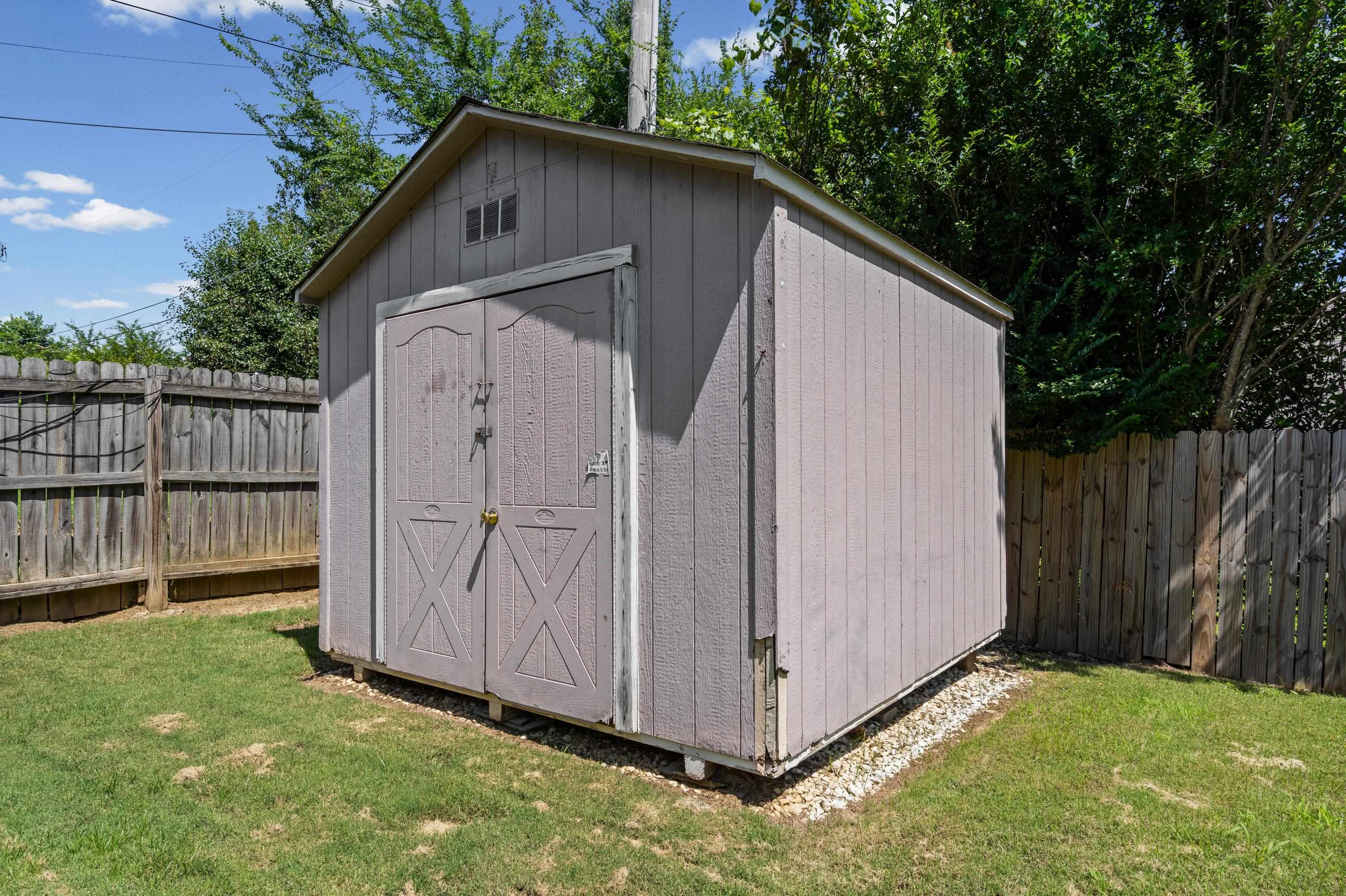 7130 Bryan Station Road Cordova, TN 38018 - Photo 19 of 26 Storage shed featuring double doors and an upper ventilation panel