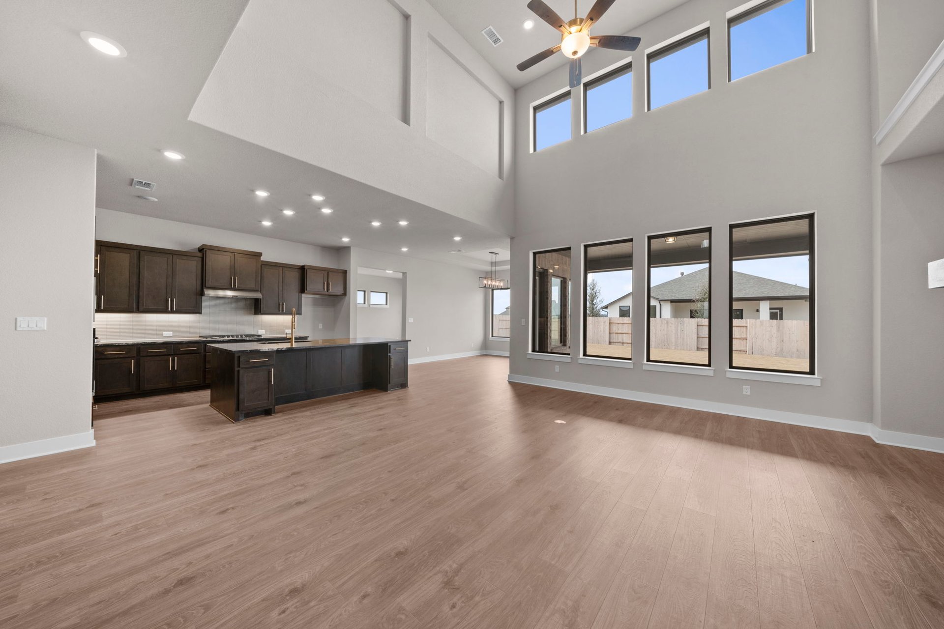 812 South Hemingway Loop Liberty Hill, TX 78642 - Photo 17 of 39 From Family Room to Open Concept Kitchen