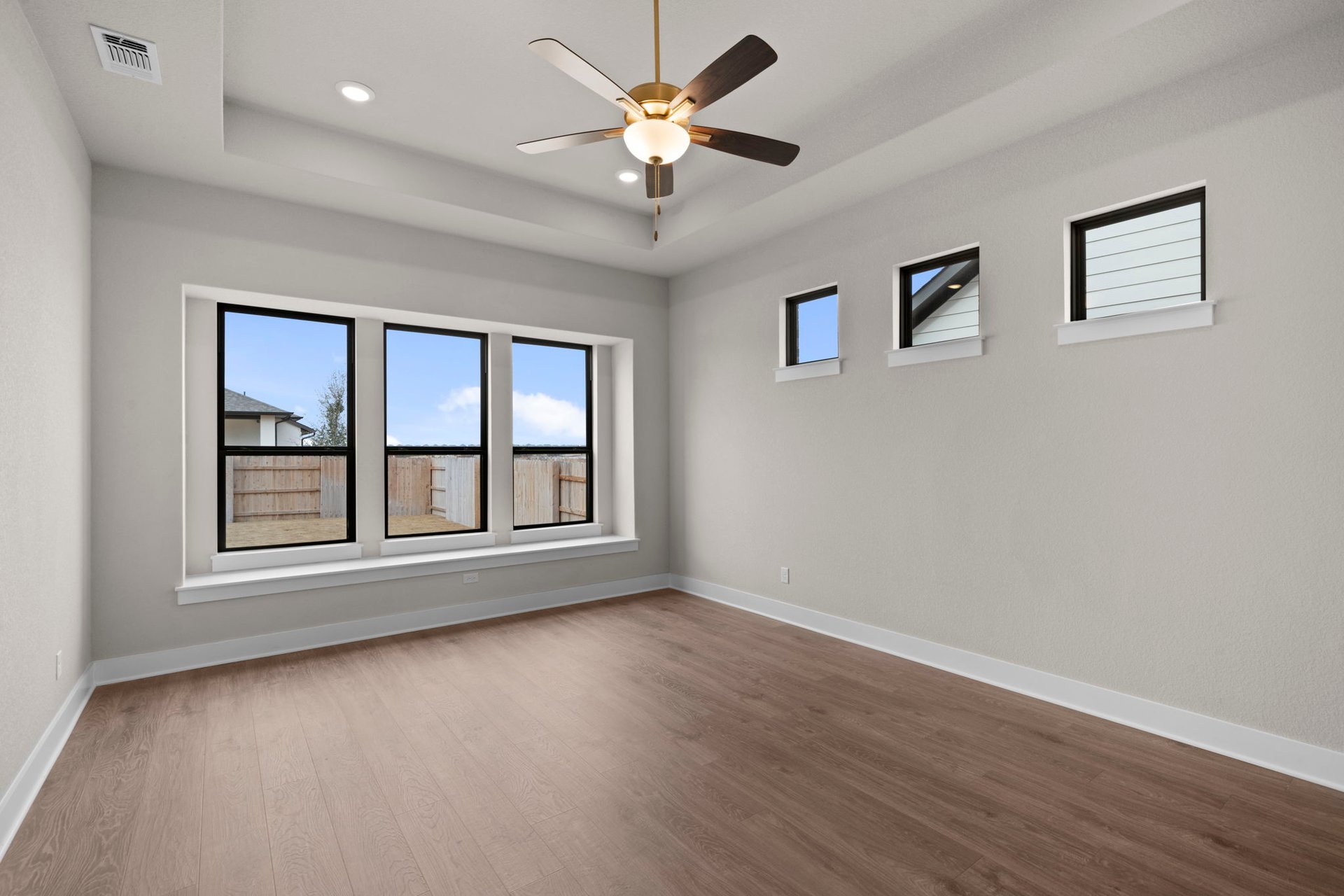 812 South Hemingway Loop Liberty Hill, TX 78642 - Photo 18 of 39 Primary Bedroom with tray ceiling
