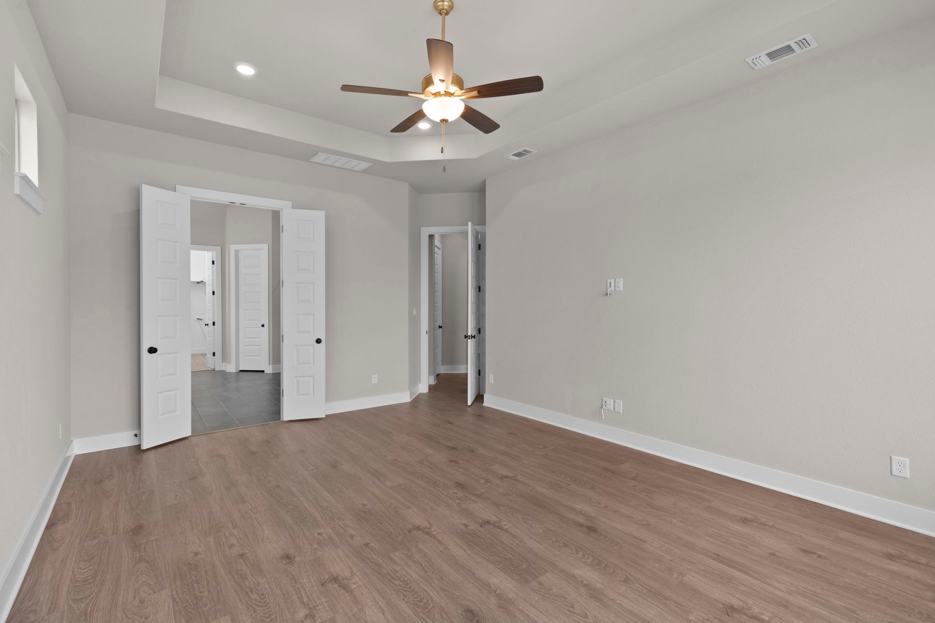 812 South Hemingway Loop Liberty Hill, TX 78642 - Photo 19 of 39 Primary Bedroom with tray ceiling