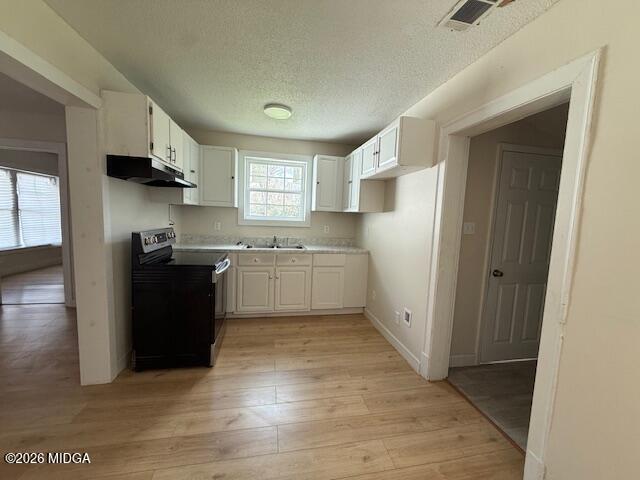 962 Troupe Street Macon, GA 31206 - Photo 4 of 11 a kitchen with stainless steel appliances granite countertop a refrigerator and a sink