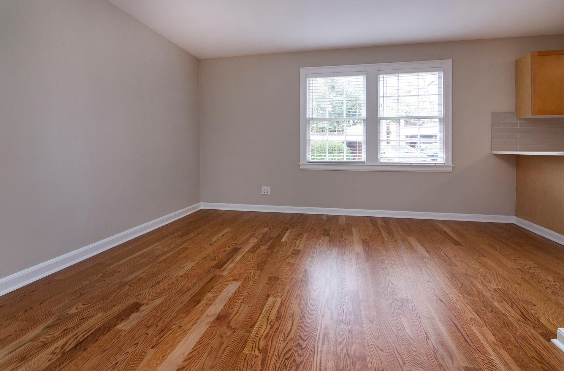 104 Colville Road, Unit 41A Charlotte, NC 28207 - Photo 11 of 21 wooden floor in an empty room with a window
