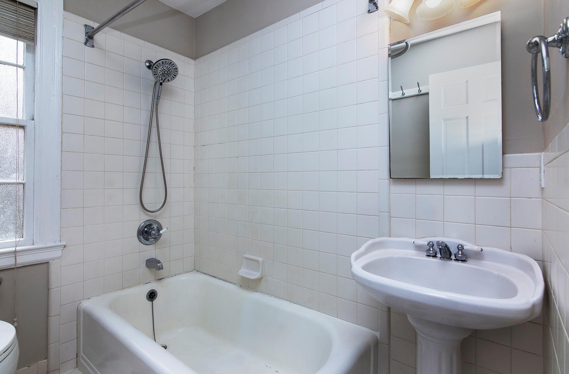 104 Colville Road, Unit 41A Charlotte, NC 28207 - Photo 12 of 21 a bathroom with a sink a toilet and shower