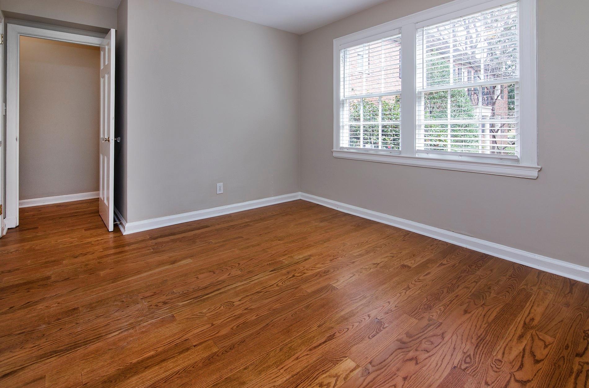 104 Colville Road, Unit 41A Charlotte, NC 28207 - Photo 15 of 21 an empty room with wooden floor and windows