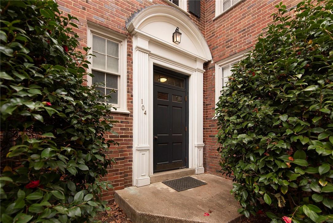 104 Colville Road, Unit 41A Charlotte, NC 28207 - Photo 18 of 21 a front view of a house with a garden