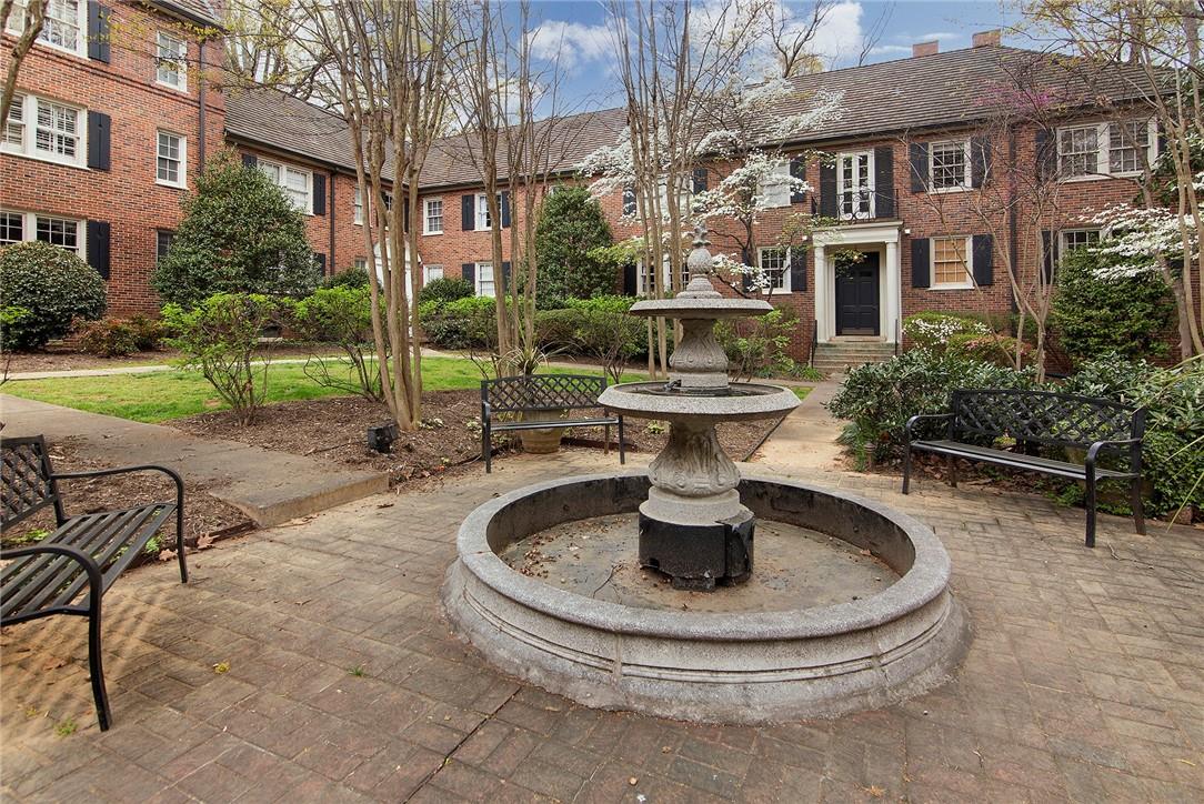 104 Colville Road, Unit 41A Charlotte, NC 28207 - Photo 2 of 21 a view of a house with backyard fountain and sitting area