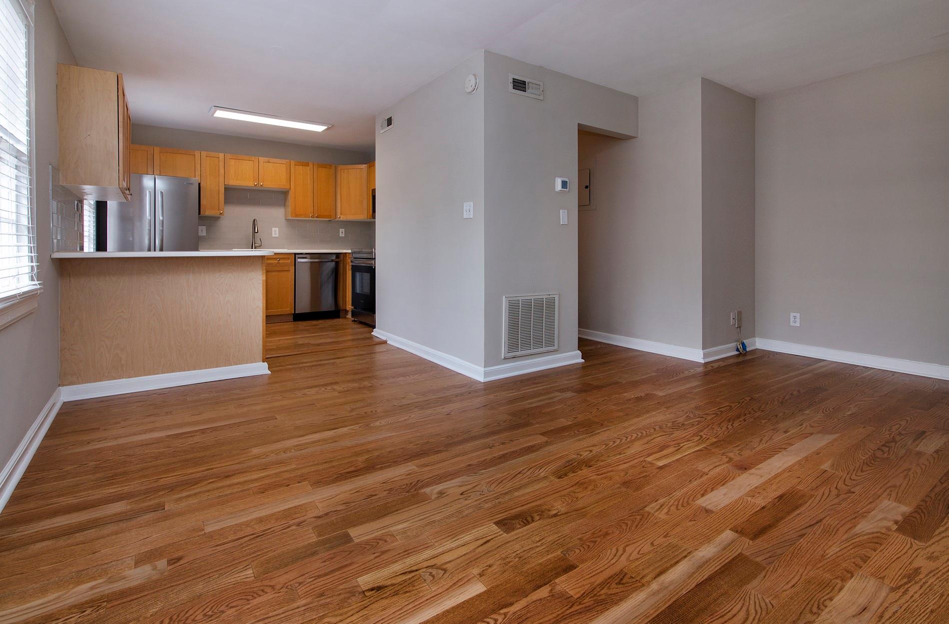 104 Colville Road, Unit 41A Charlotte, NC 28207 - Photo 3 of 21 an empty room with wooden floor and windows