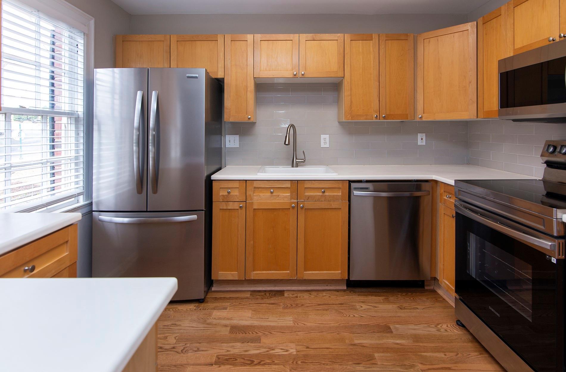 104 Colville Road, Unit 41A Charlotte, NC 28207 - Photo 4 of 21 a kitchen with a refrigerator sink and microwave