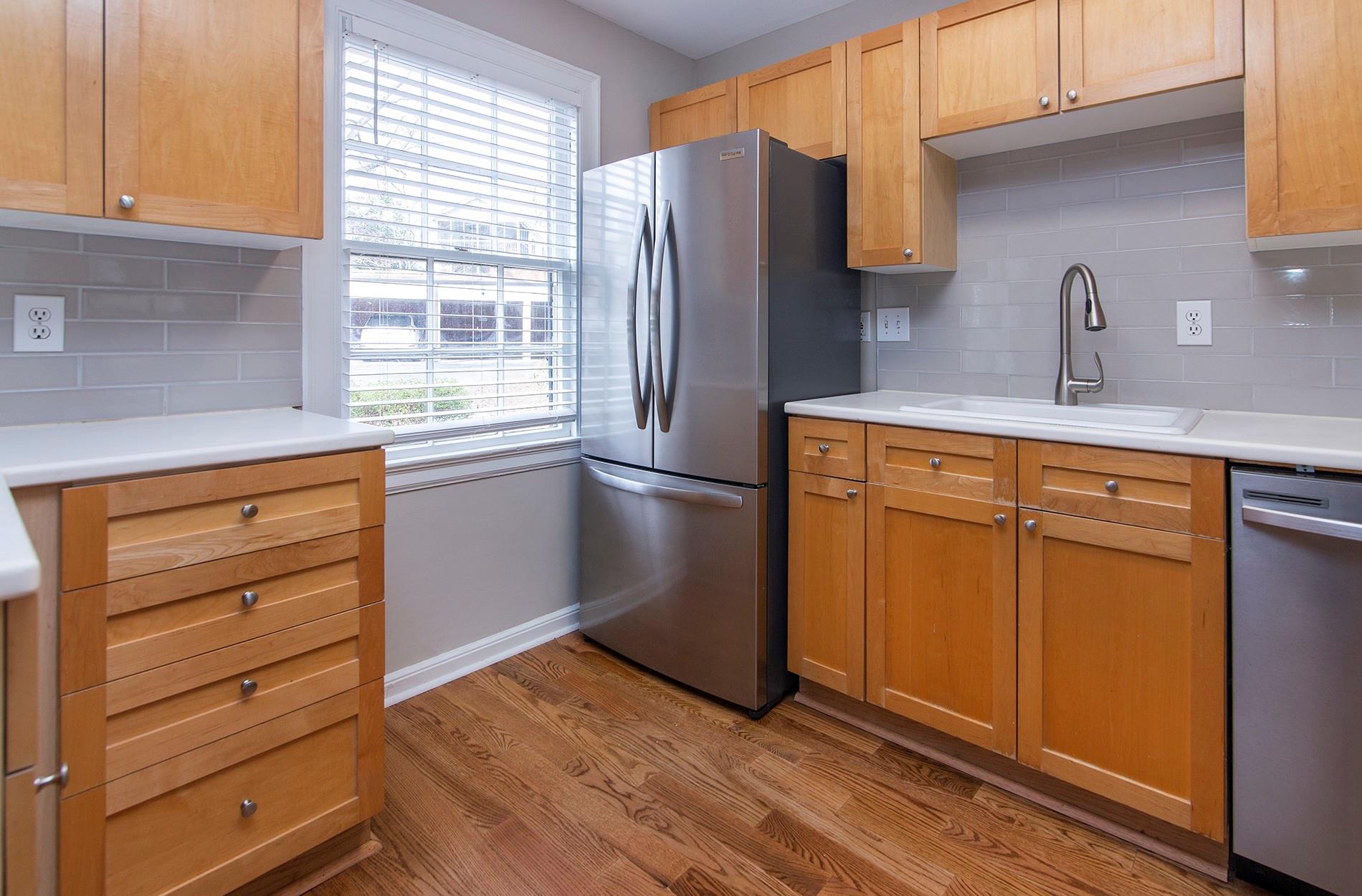 104 Colville Road, Unit 41A Charlotte, NC 28207 - Photo 6 of 21 a kitchen with granite countertop stainless steel appliances and cabinets