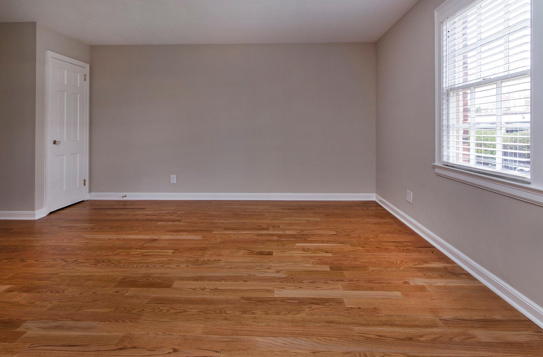 104 Colville Road, Unit 41A Charlotte, NC 28207 - Photo 10 of 21 a view of an empty room with wooden floor and a window
