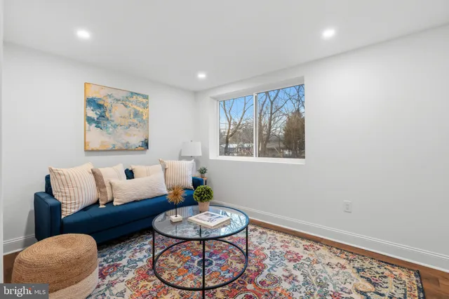 a living room with furniture and a rug
