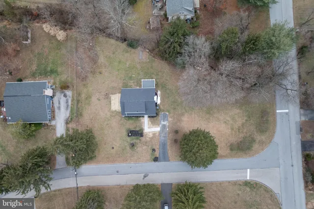 an aerial view of a house with outdoor space