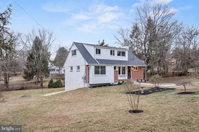 a house that has a tree in front of it