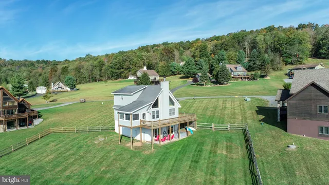 a front view of a house with a yard table and chairs