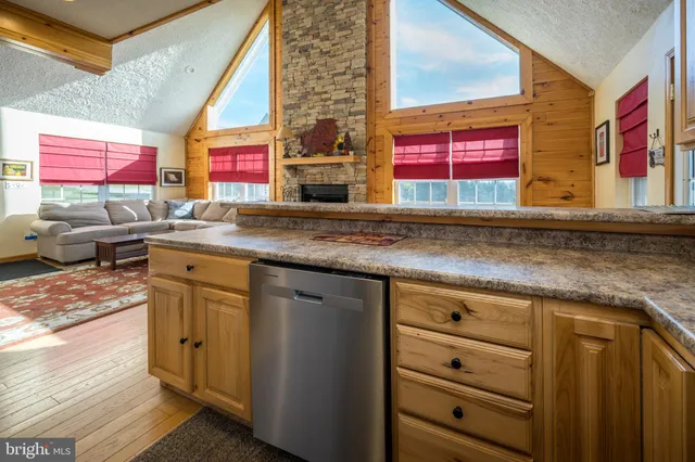 a bedroom with a bed next to a window