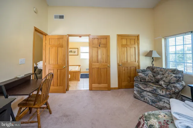 a bathroom with a granite countertop shower a sink and a stove