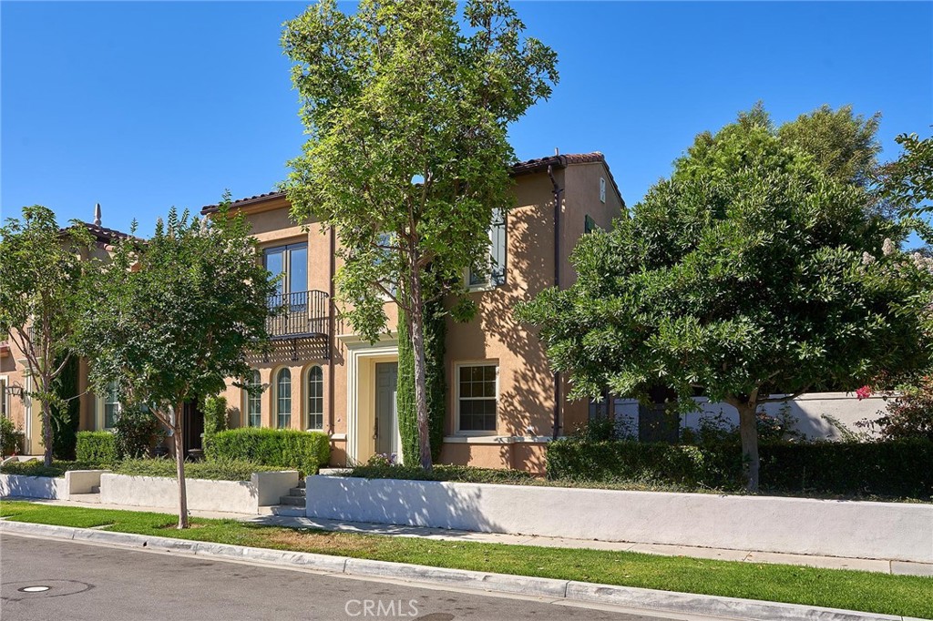 a view of a brick building next to a yard