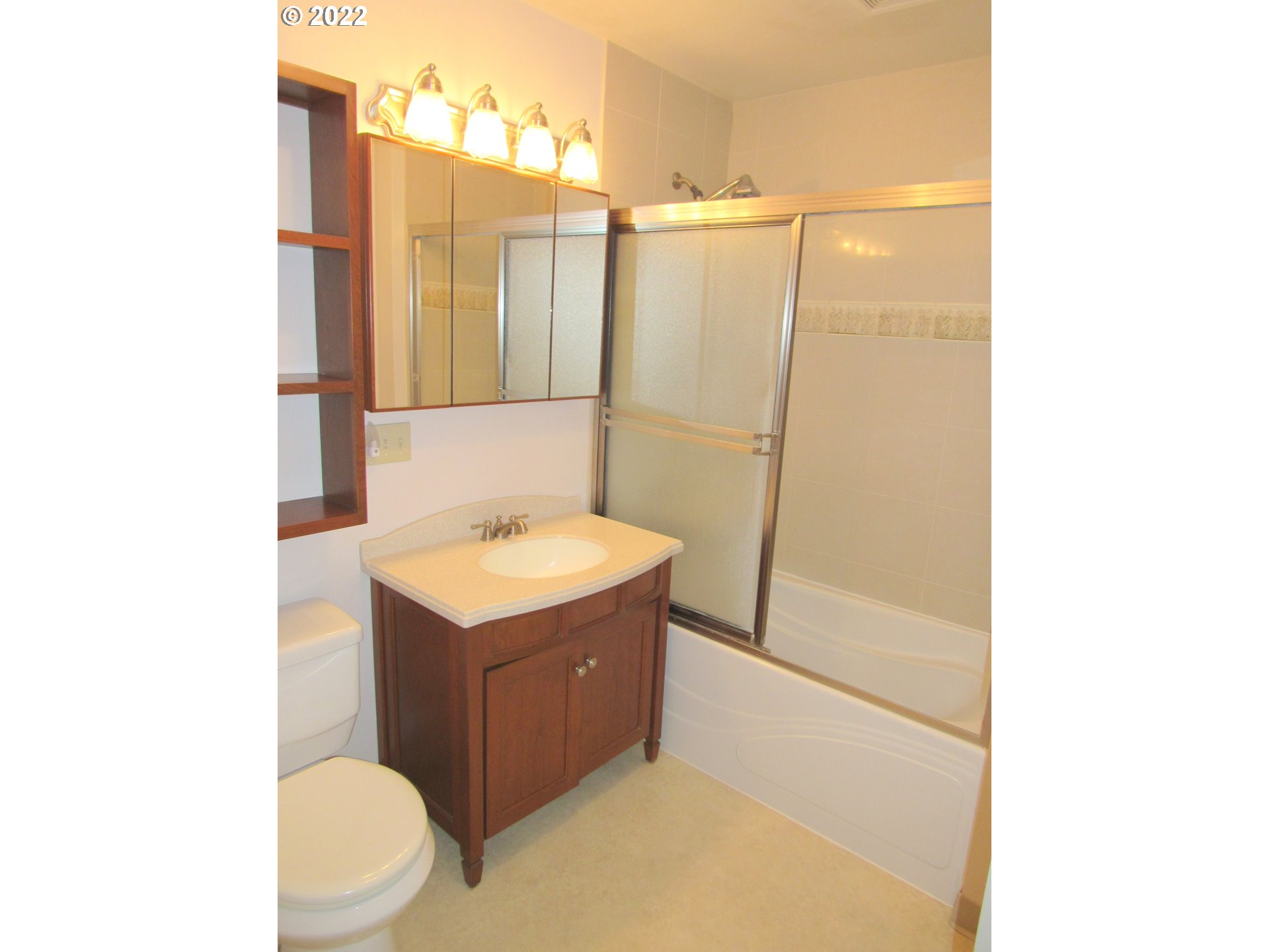 69 Pacific Place Longview, WA 98632 - Photo 19 of 32 a bathroom with a sink a toilet and shower