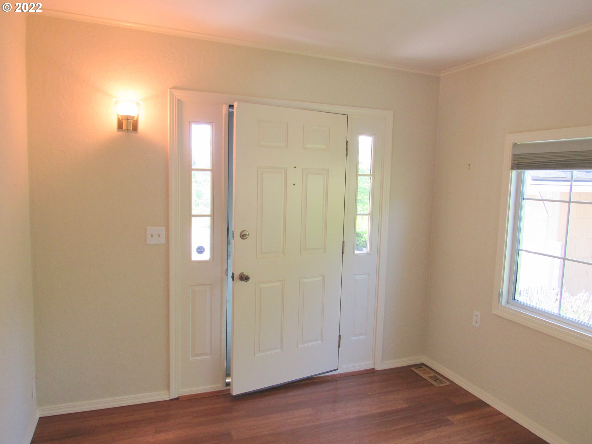 69 Pacific Place Longview, WA 98632 - Photo 4 of 32 an empty room with wooden floor and windows