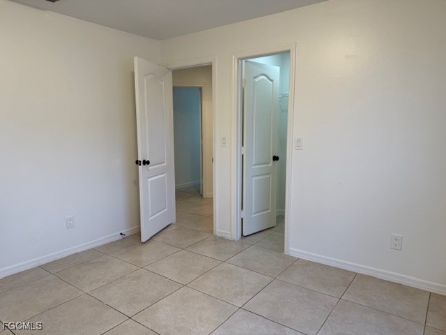 3906 13th Street West Lehigh Acres, FL 33971 - Photo 14 of 26 an empty room with mirror