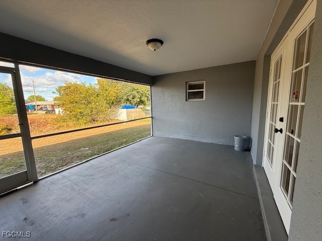 3906 13th Street West Lehigh Acres, FL 33971 - Photo 23 of 26 wooden floor in an empty room with a large window
