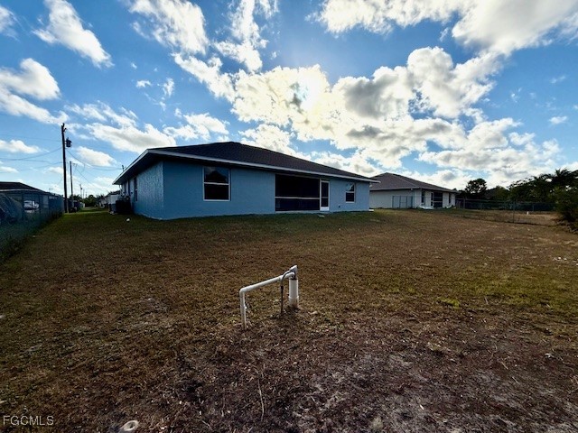 3906 13th Street West Lehigh Acres, FL 33971 - Photo 26 of 26 a view of a house with a yard