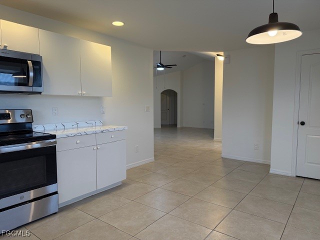 3906 13th Street West Lehigh Acres, FL 33971 - Photo 5 of 26 a kitchen with a stove and a sink