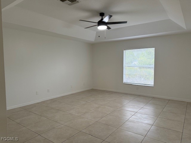3906 13th Street West Lehigh Acres, FL 33971 - Photo 7 of 26 an empty room with a ceiling fan and window