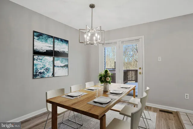 a bathroom with a toilet sink vanity and mirror