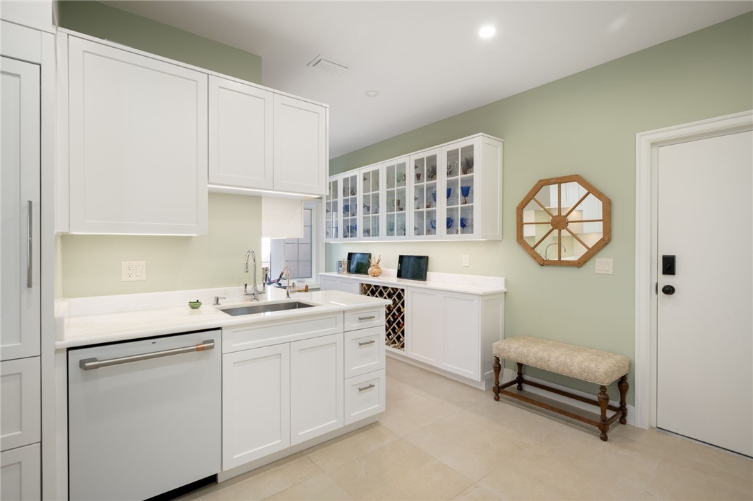 1050 Reef Road, Unit 102 Vero Beach, FL 32963 - Photo 11 of 36 a utility room with cabinets dryer and washer
