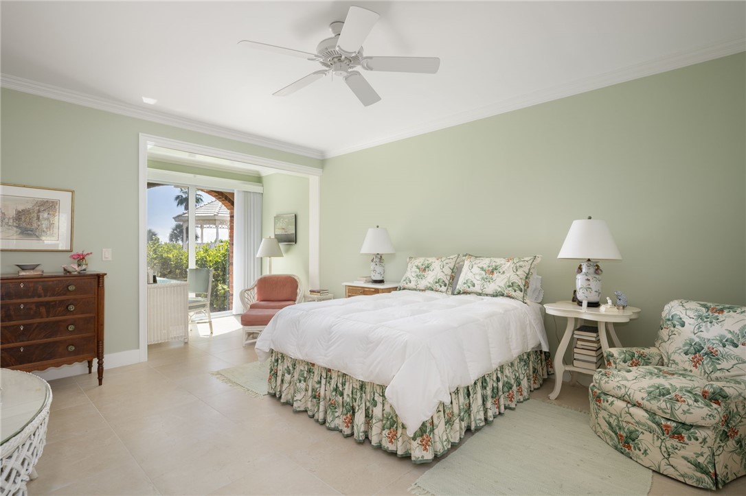 1050 Reef Road, Unit 102 Vero Beach, FL 32963 - Photo 12 of 36 a bedroom with a bed and window
