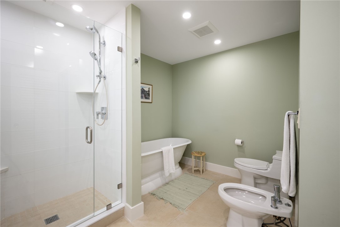 1050 Reef Road, Unit 102 Vero Beach, FL 32963 - Photo 14 of 36 a bathroom with a toilet and a shower