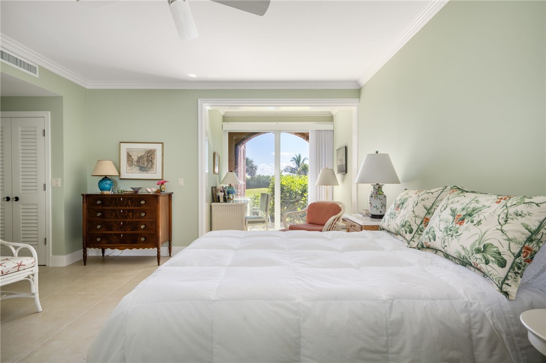 1050 Reef Road, Unit 102 Vero Beach, FL 32963 - Photo 15 of 36 a bedroom with a bed and furniture