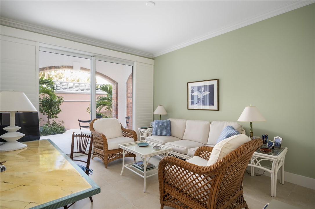 1050 Reef Road, Unit 102 Vero Beach, FL 32963 - Photo 17 of 36 a living room with furniture and a large window
