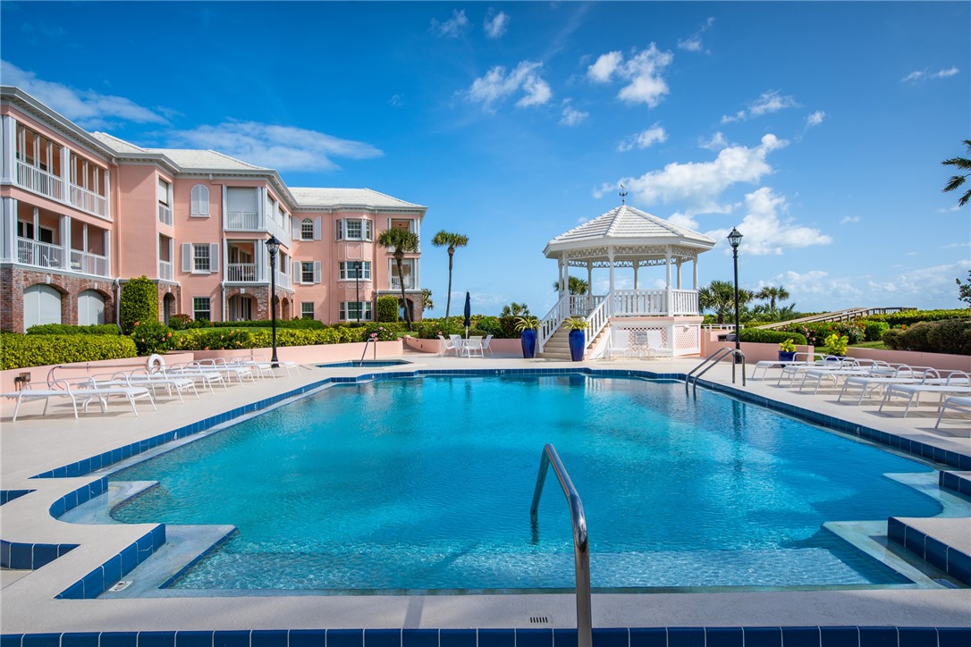 1050 Reef Road, Unit 102 Vero Beach, FL 32963 - Photo 26 of 36 a view of a swimming pool and a chairs