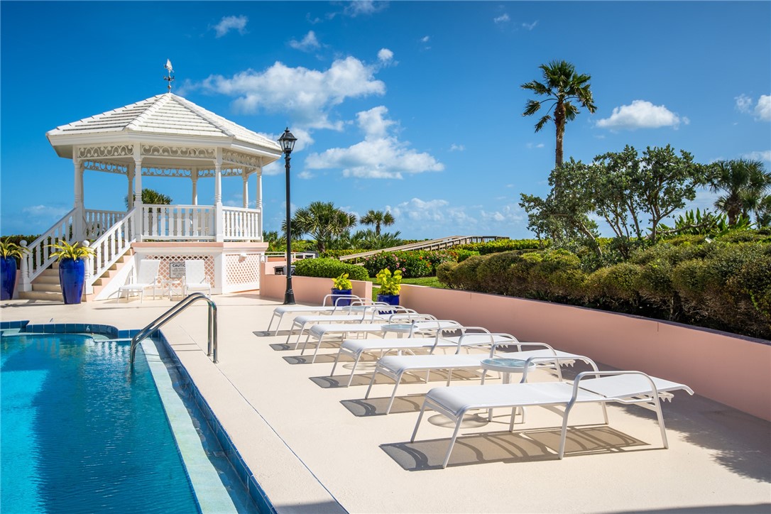 1050 Reef Road, Unit 102 Vero Beach, FL 32963 - Photo 27 of 36 a view of a house with backyard and sitting area
