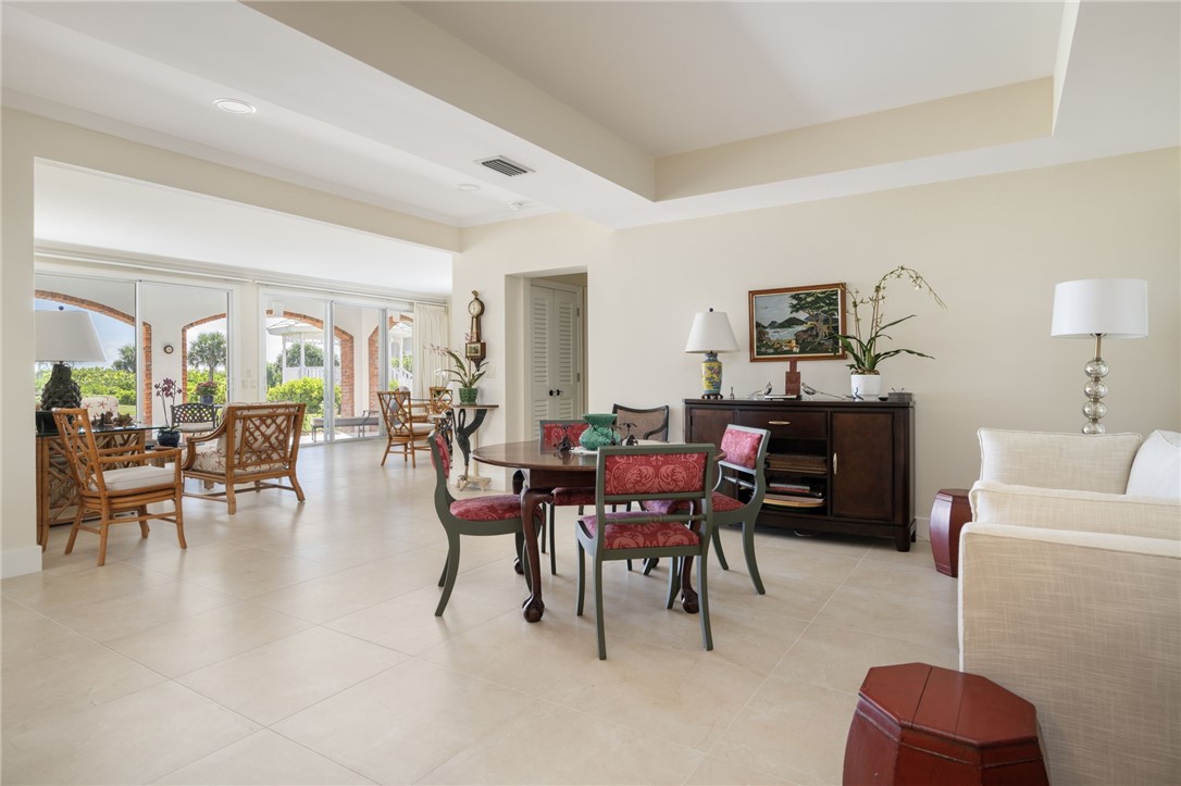 1050 Reef Road, Unit 102 Vero Beach, FL 32963 - Photo 5 of 36 a view of a livingroom with furniture and window