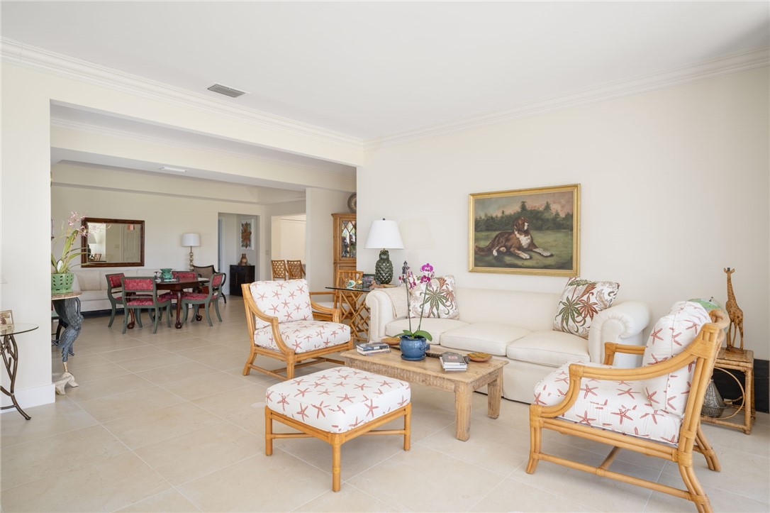 1050 Reef Road, Unit 102 Vero Beach, FL 32963 - Photo 8 of 36 a living room with furniture and a potted plant