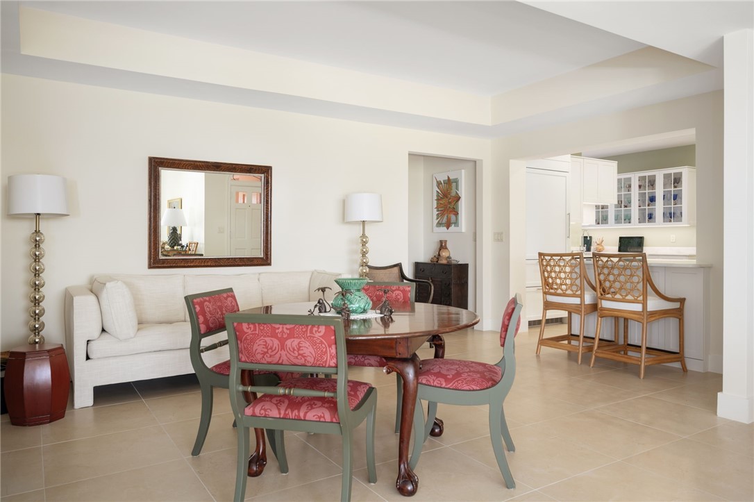 1050 Reef Road, Unit 102 Vero Beach, FL 32963 - Photo 9 of 36 a room with furniture and a wooden floor