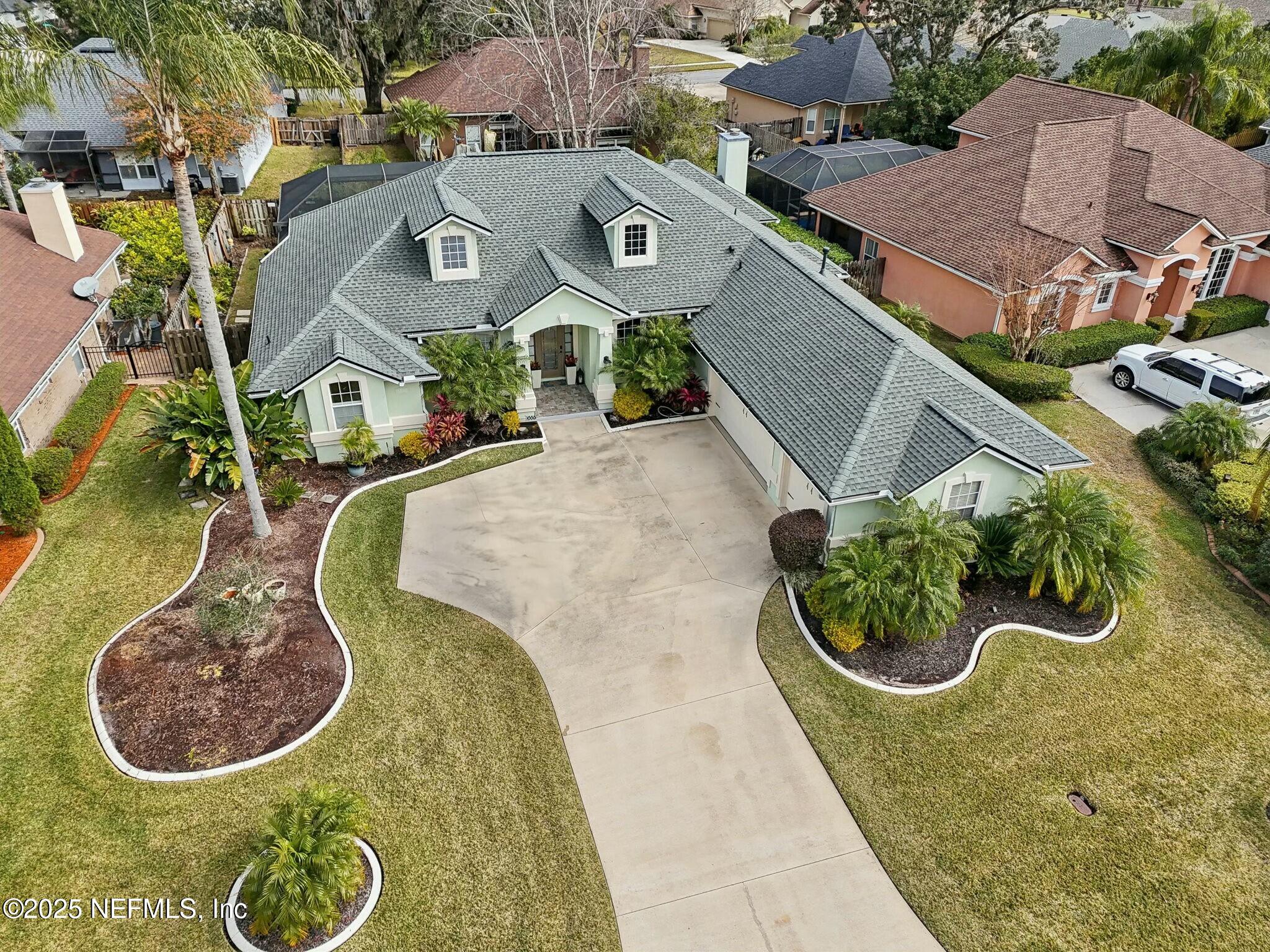 an aerial view of a house with garden
