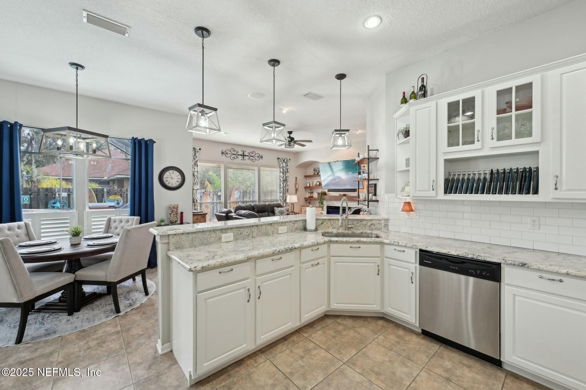 1732 Margarets Walk Road Fleming Island, FL 32003 - Photo 11 of 55 a kitchen with cabinets and window