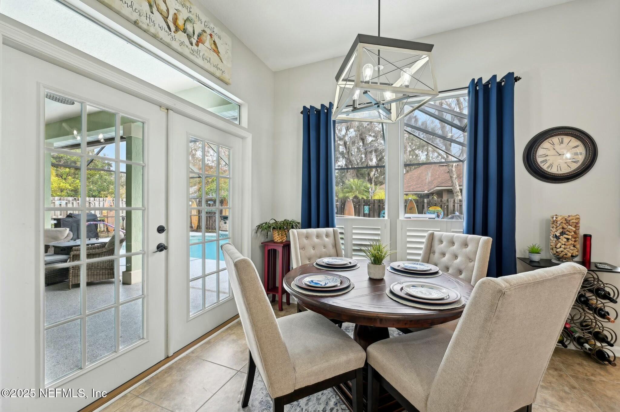 1732 Margarets Walk Road Fleming Island, FL 32003 - Photo 13 of 55 a view of a dining room with furniture window and outside view