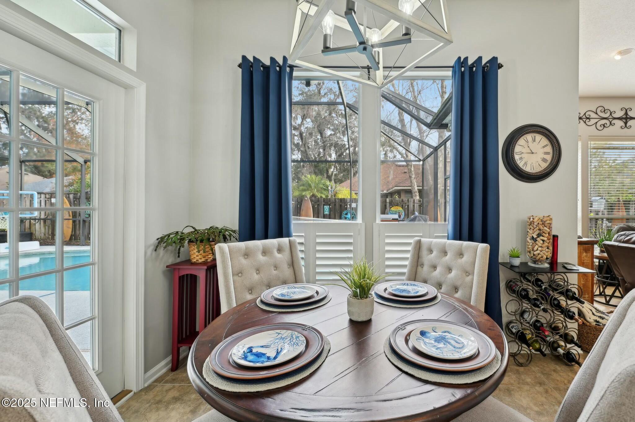 1732 Margarets Walk Road Fleming Island, FL 32003 - Photo 14 of 55 a table and chairs sitting area with furniture