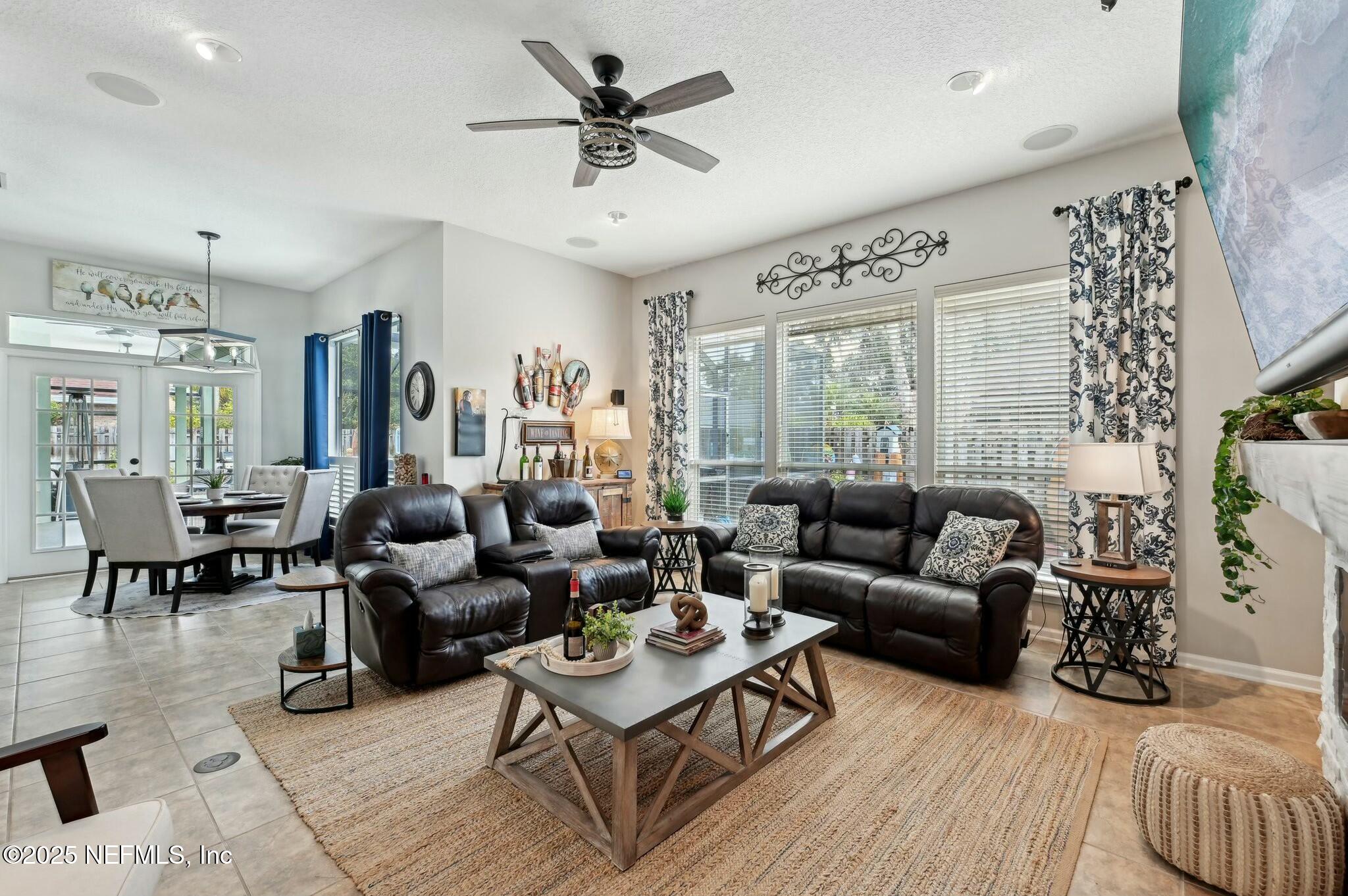 1732 Margarets Walk Road Fleming Island, FL 32003 - Photo 18 of 55 a living room with furniture and a large window