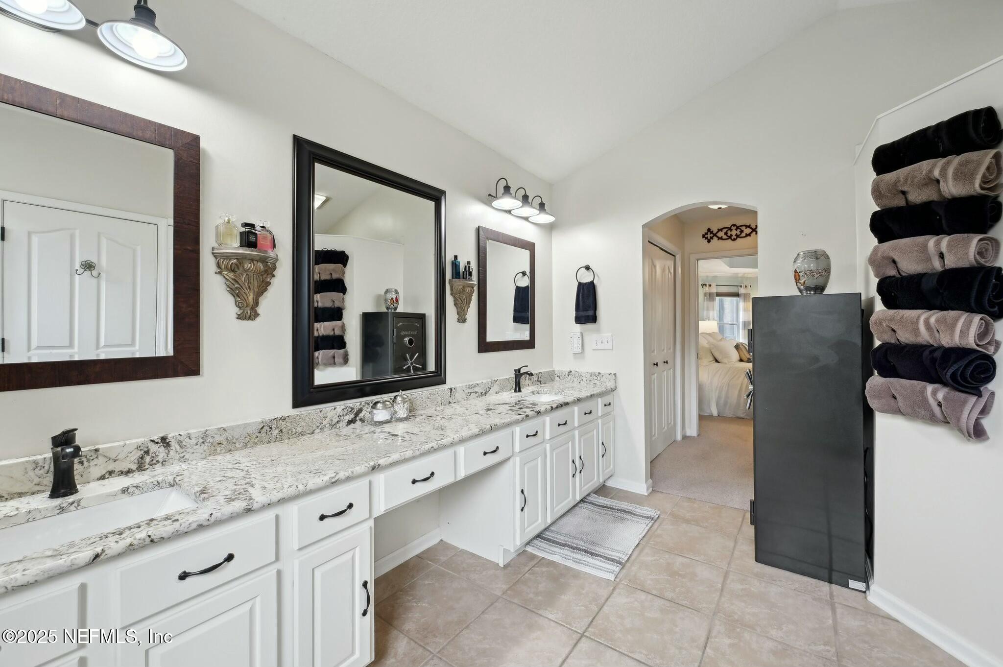 1732 Margarets Walk Road Fleming Island, FL 32003 - Photo 25 of 55 a bathroom with a granite countertop double vanity sink and mirror
