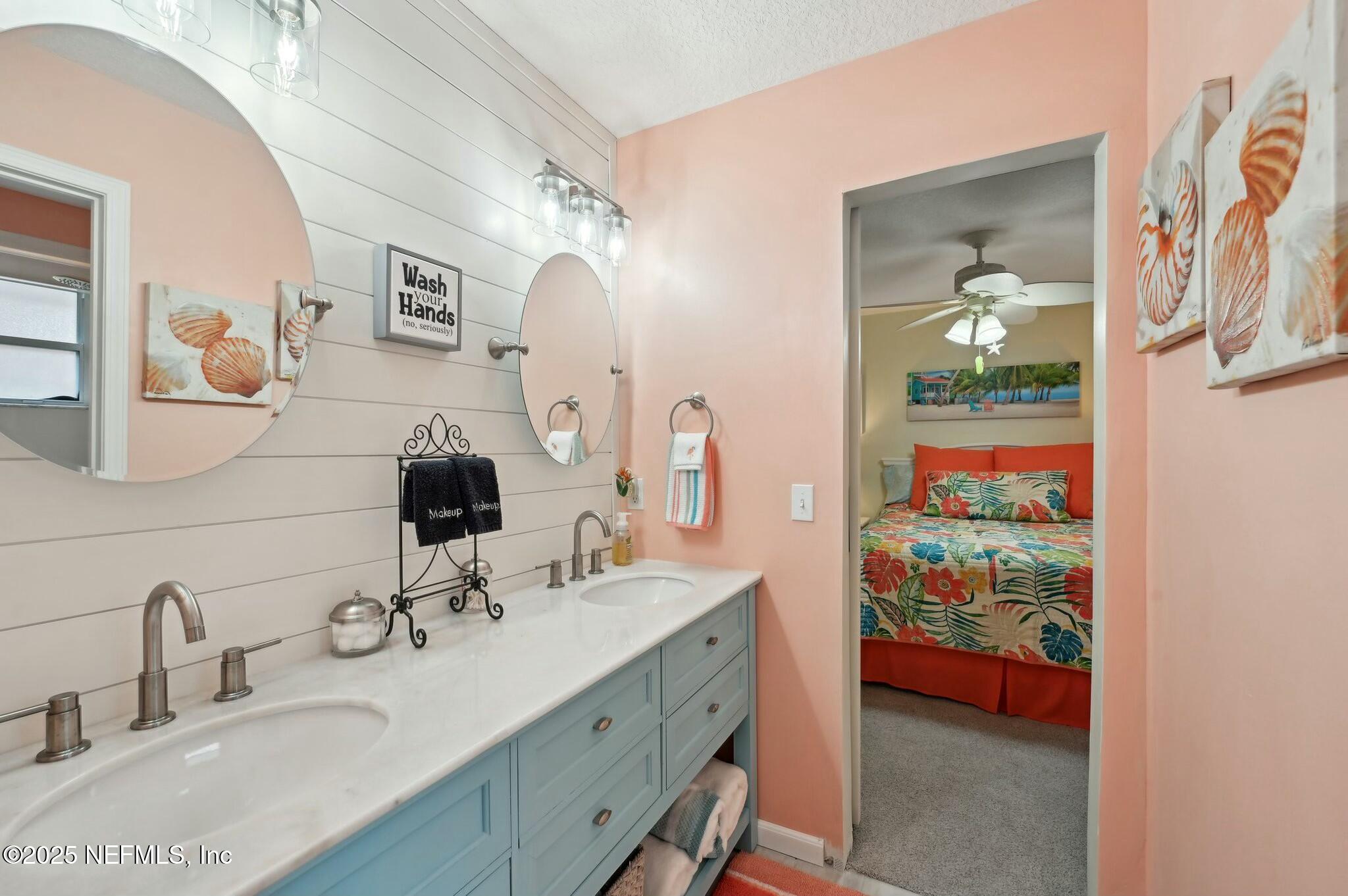 1732 Margarets Walk Road Fleming Island, FL 32003 - Photo 31 of 55 a bathroom with double vanity sink and a mirror